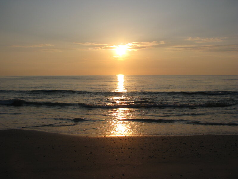 Sun Setting over Ocean — Yellow, Serene, Sunset, Photograph, Sand