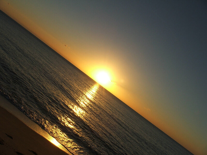 Sun Setting over Ocean — Yellow, Serene, Sunset, Photograph, Sky, Beach, Blue