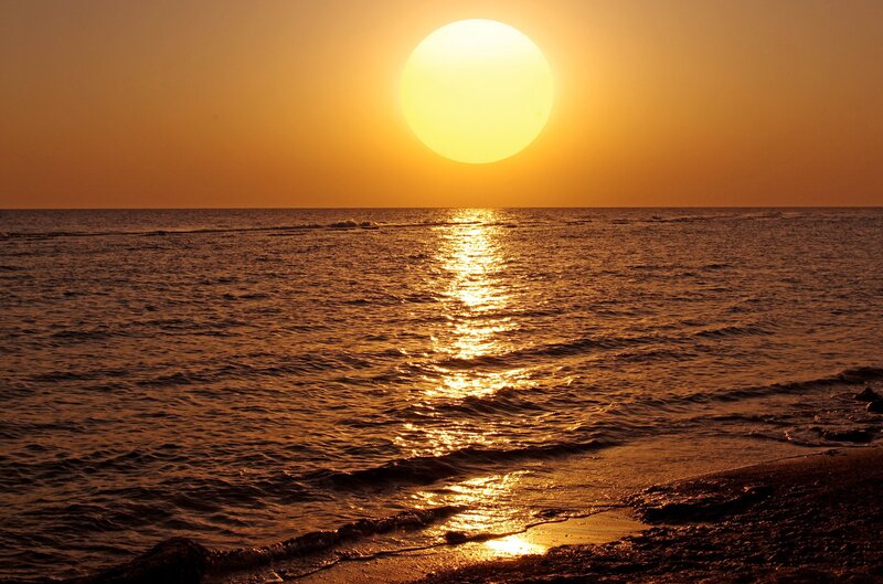 Sun Setting over Ocean — Yellow, Serene, Sunset, Photograph, Sky, Beach