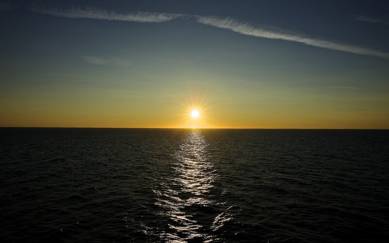 Sun Setting over Ocean — Yellow, Serene, Sunset, Photograph, Sky, Blue