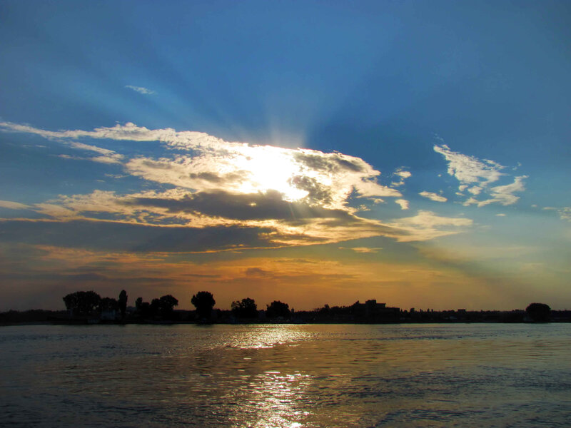 Sun Setting over River — Blue, Serene, Sunset, Photograph, Clouds