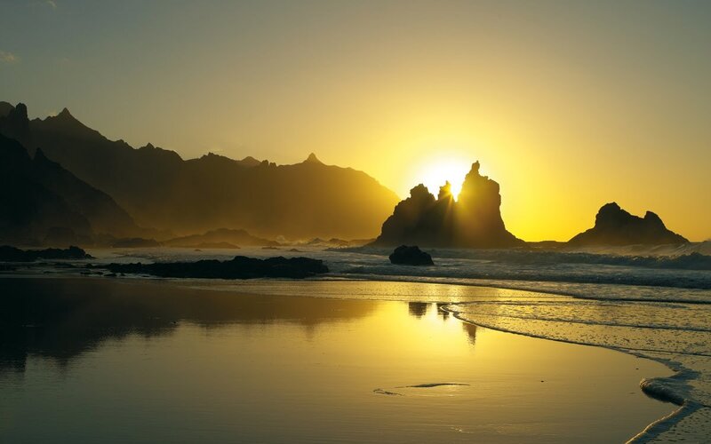Sun Setting over Rocky Beach