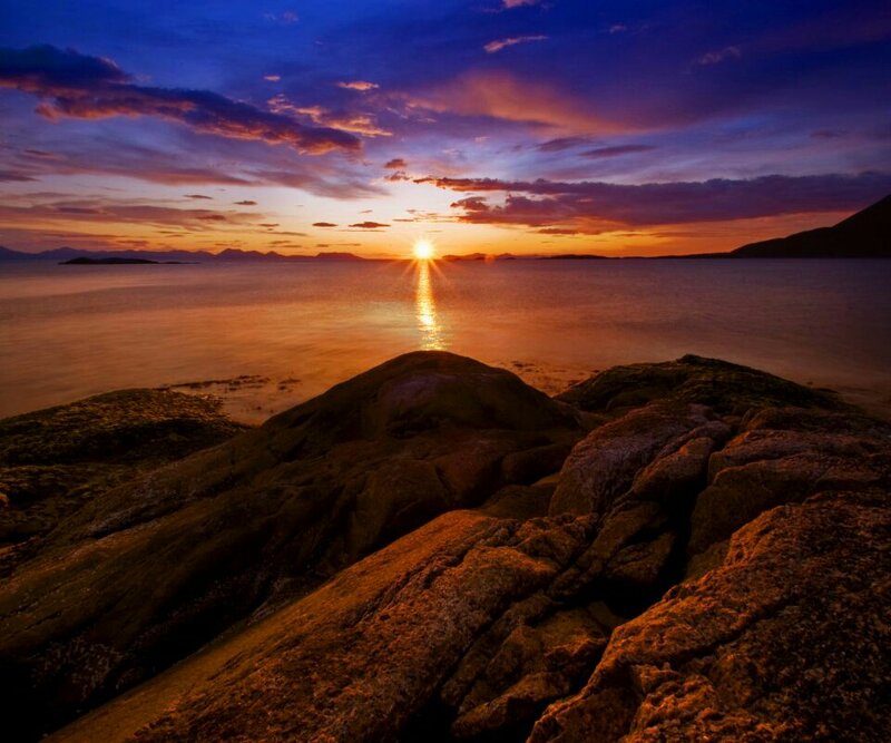 Sun Setting over Rocky Shore — Orange