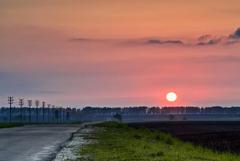 Sun Setting over Rural Road