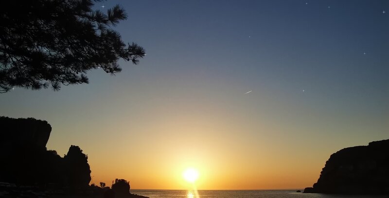 Sun Setting over Sea — Blue