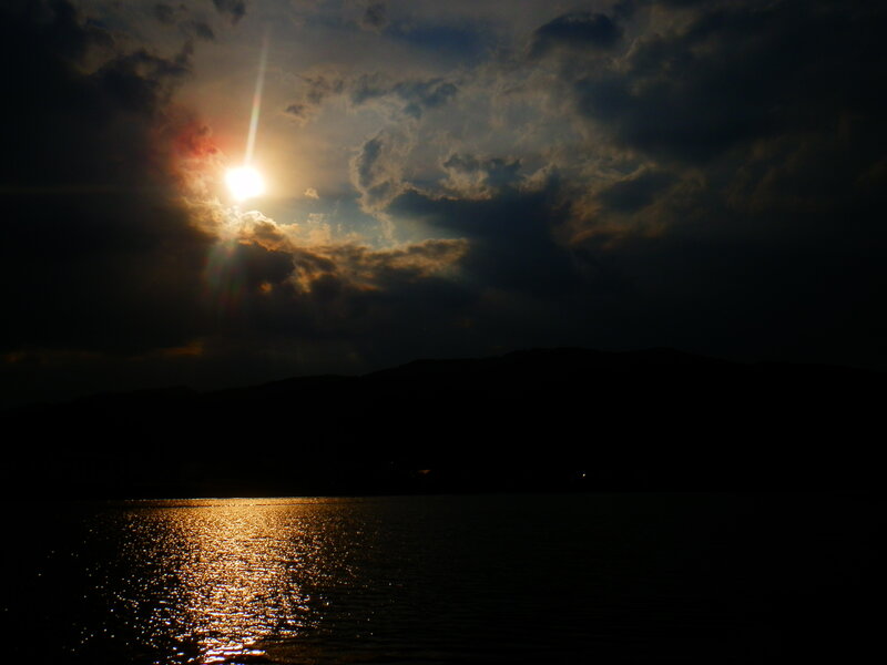 Sun Setting over Water — Black, Dramatic