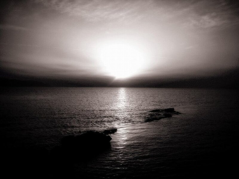 Sun Setting over Water — Black