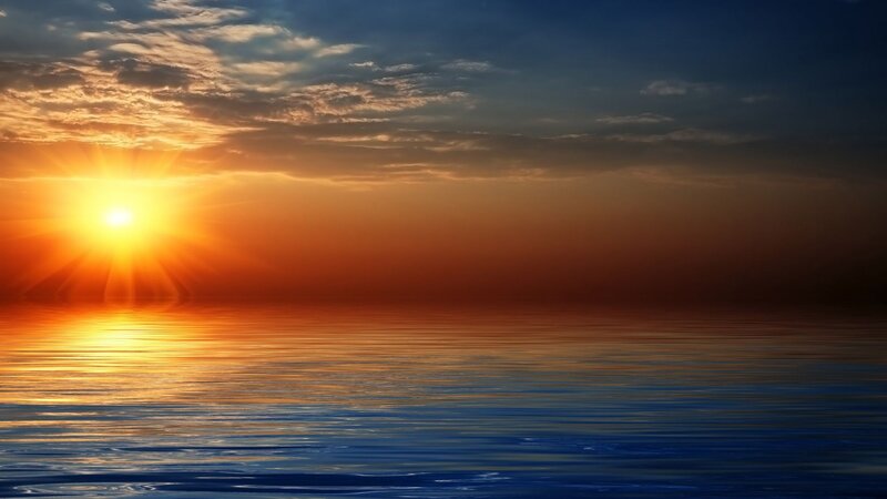 Sun Setting over Water — Clouds