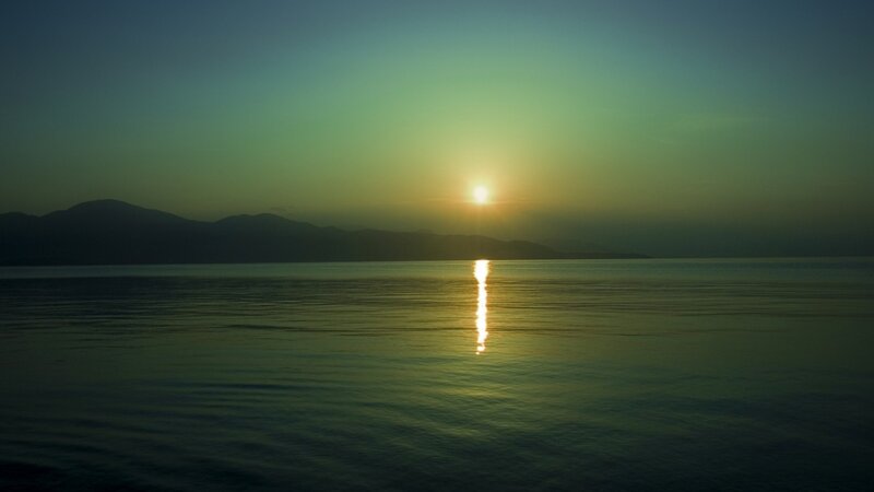 Sun Setting over Water — Green, Serene