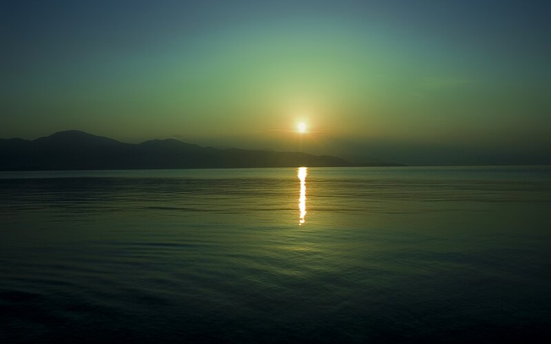 Sun Setting over Water — Green