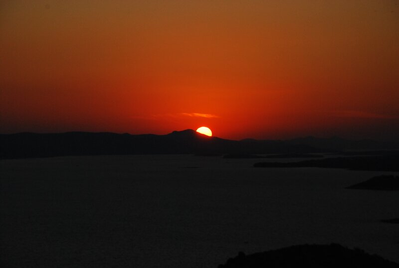 Sun Setting over Water — Orange, Dramatic, Sunset, Photograph, Mountains, Sky