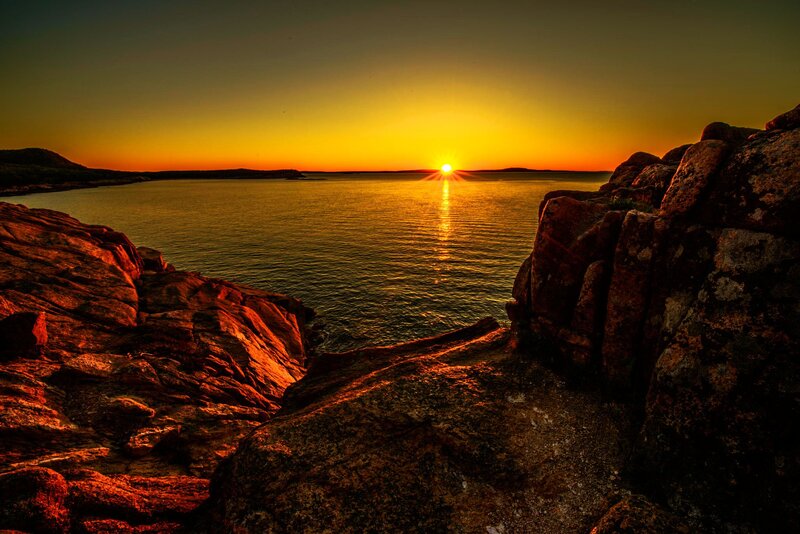 Sun Setting over Water — Orange, Dramatic, Sunset, Photograph, Rocks