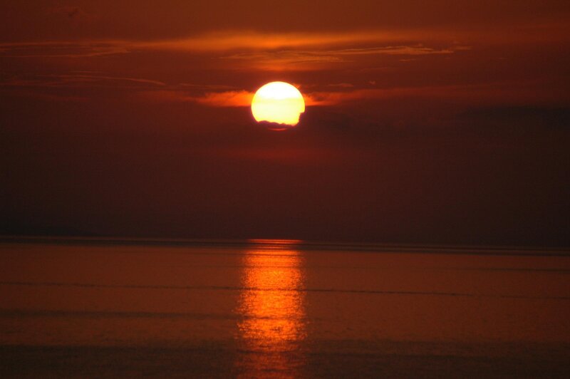 Sun Setting over Water — Orange, Dramatic, Sunset, Photograph, Sky, Red