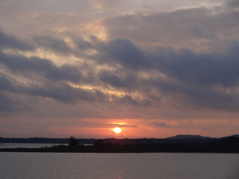 Sun Setting over Water — Orange, Serene, Sunset, Photograph, Clouds, Sky