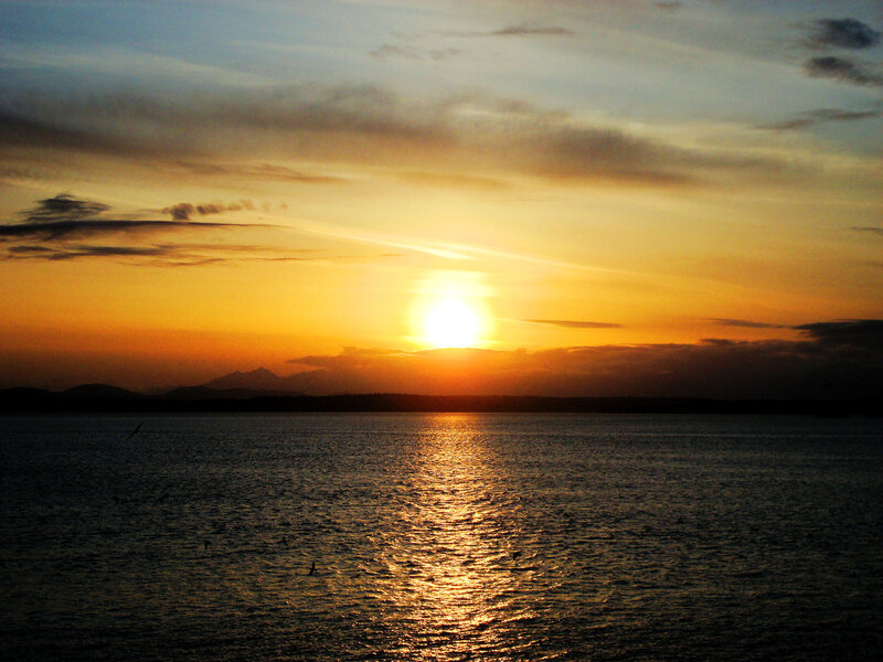 Sun Setting over Water — Orange, Serene, Sunset, Photograph, Mountains, Clouds