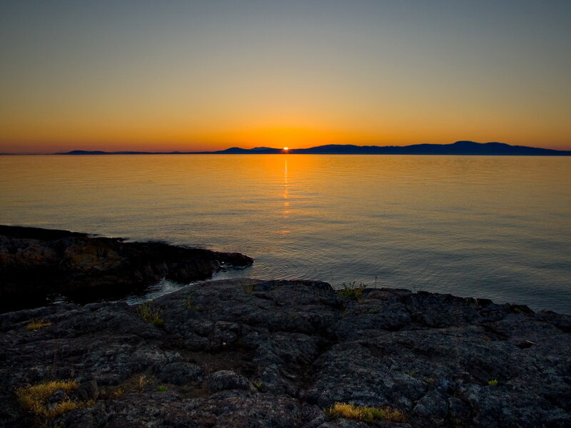 Sun Setting over Water — Orange, Serene, Sunset, Photograph, Rocks