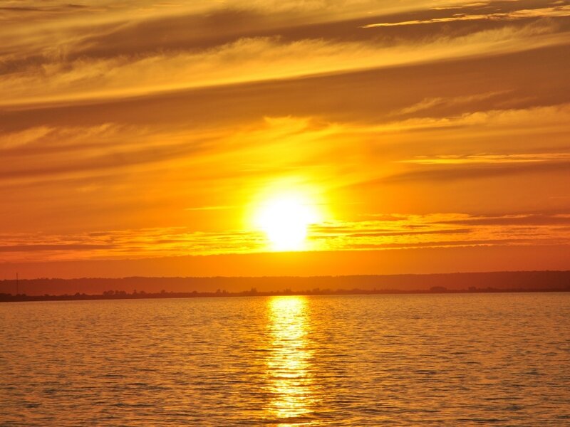 Sun Setting over Water — Orange, Serene, Sunset, Photograph, Sky, Clouds, Yellow, Gold