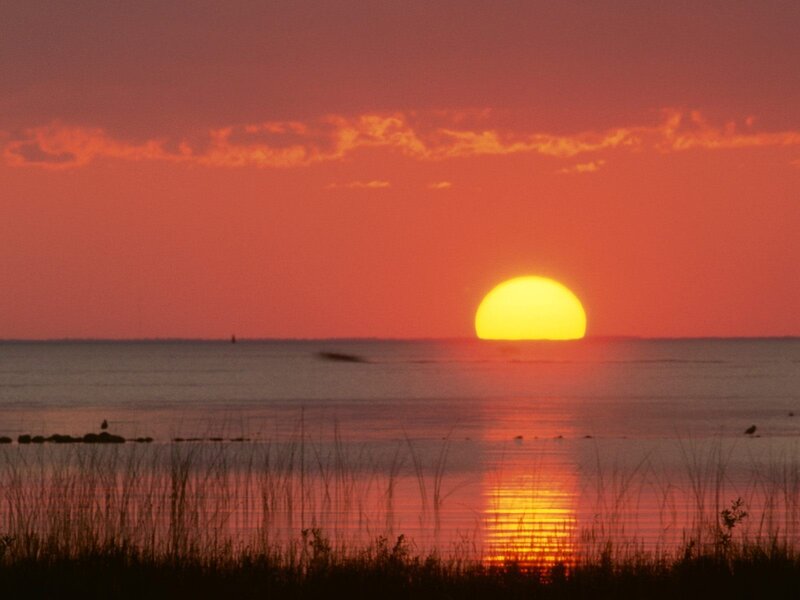 Sun Setting over Water — Orange, Serene, Sunset, Photograph, Sky, Grass, Red, Yellow