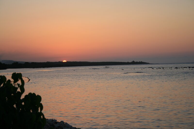 Sun Setting over Water — Orange, Serene, Sunset, Photograph, Sky, Land