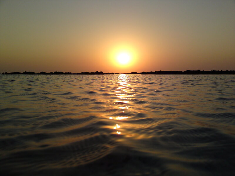 Sun Setting over Water — Orange, Serene