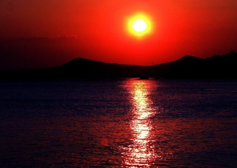 Sun Setting over Water — Red, Dramatic, Sunset, Photograph, Mountains