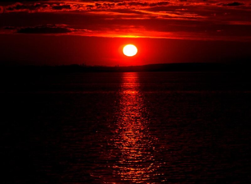 Sun Setting over Water — Red, Dramatic, Sunset, Photograph, Sky, Clouds