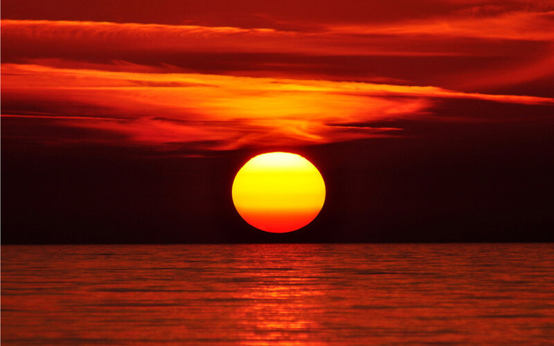 Sun Setting over Water — Red, Dramatic, Sunset, Photograph, Sky