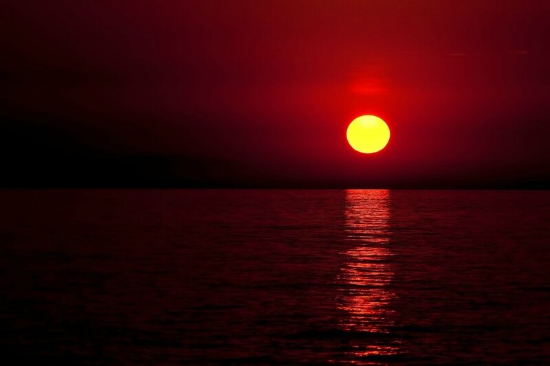 Sun Setting over Water — Red, Dramatic