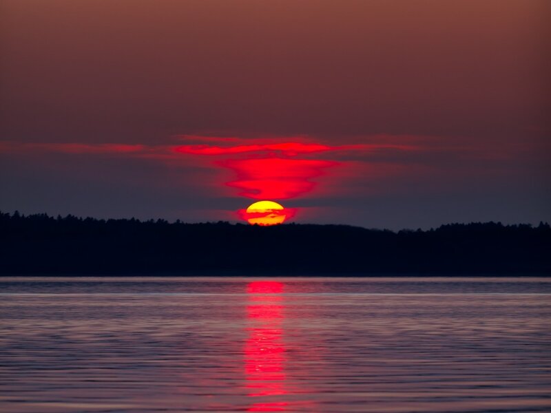 Sun Setting over Water — Red