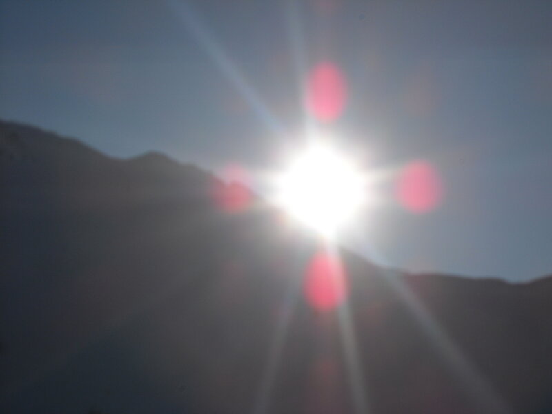 Sun shining over mountains