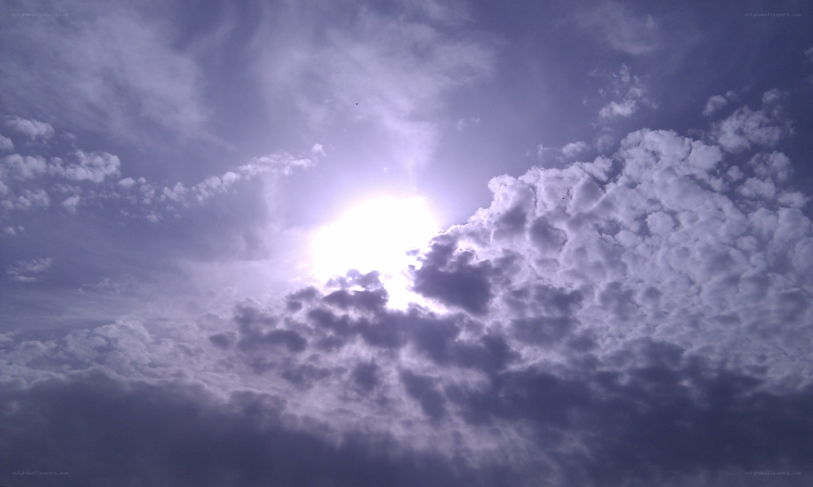 Sun shining through clouds