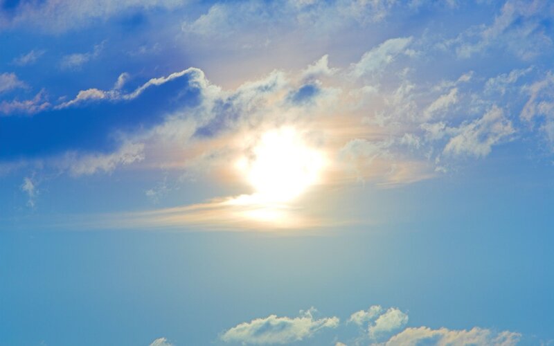 Sun shining through clouds