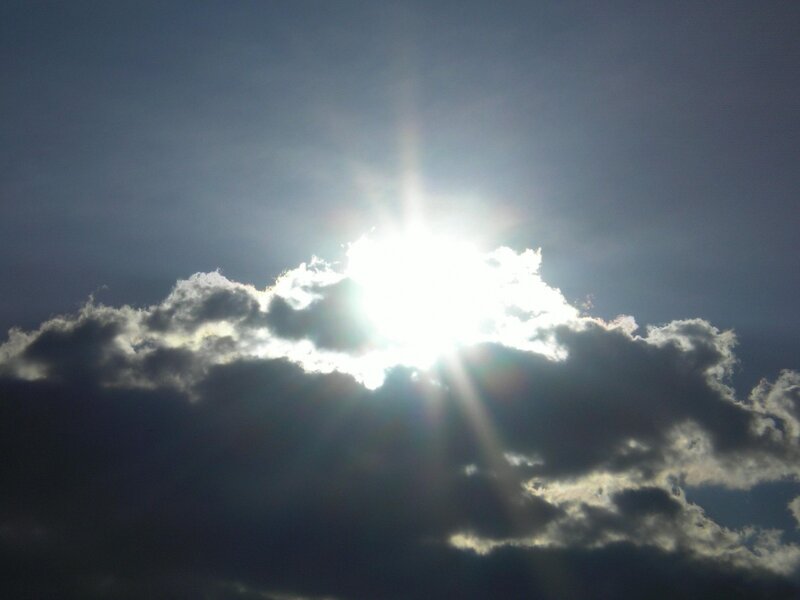 Sun shining through clouds