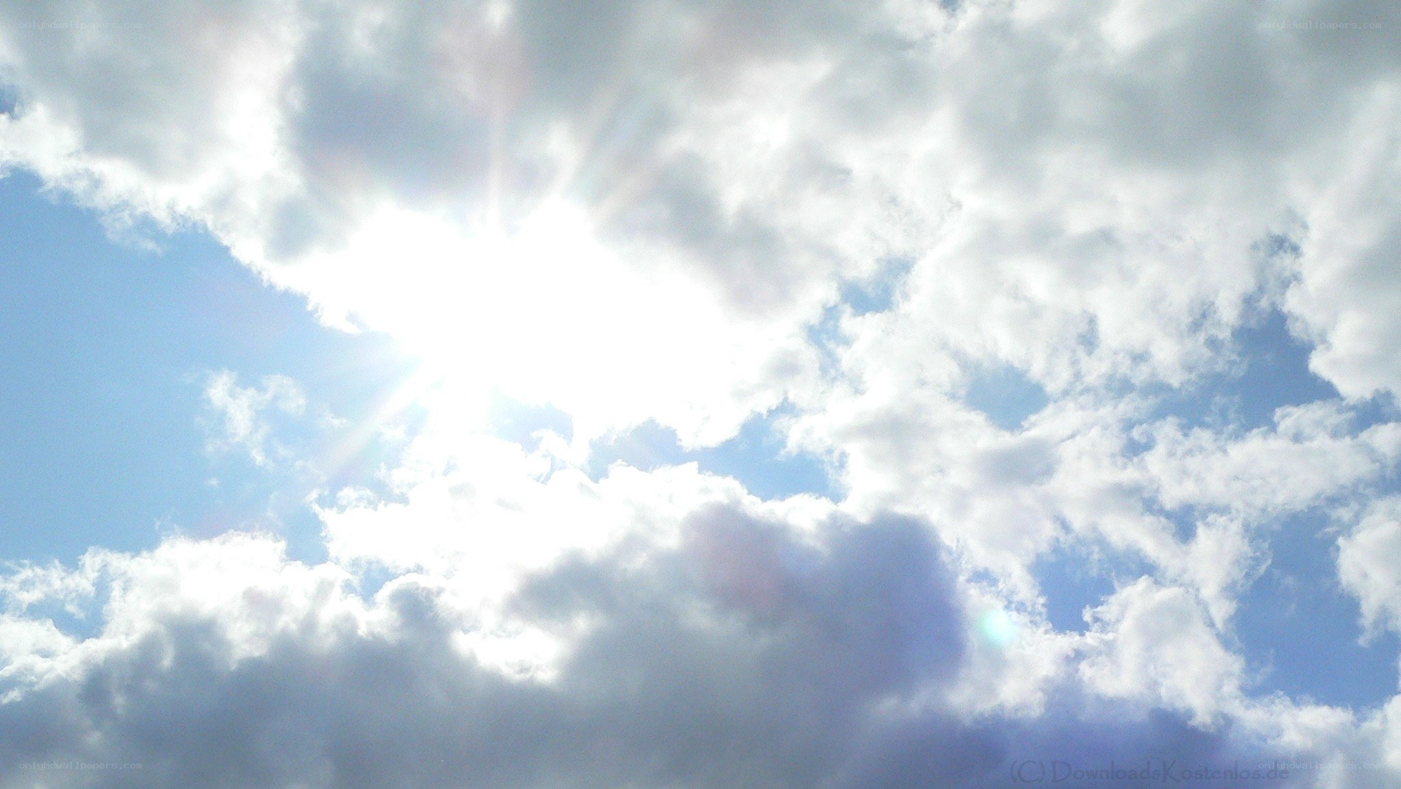 Sun shining through clouds