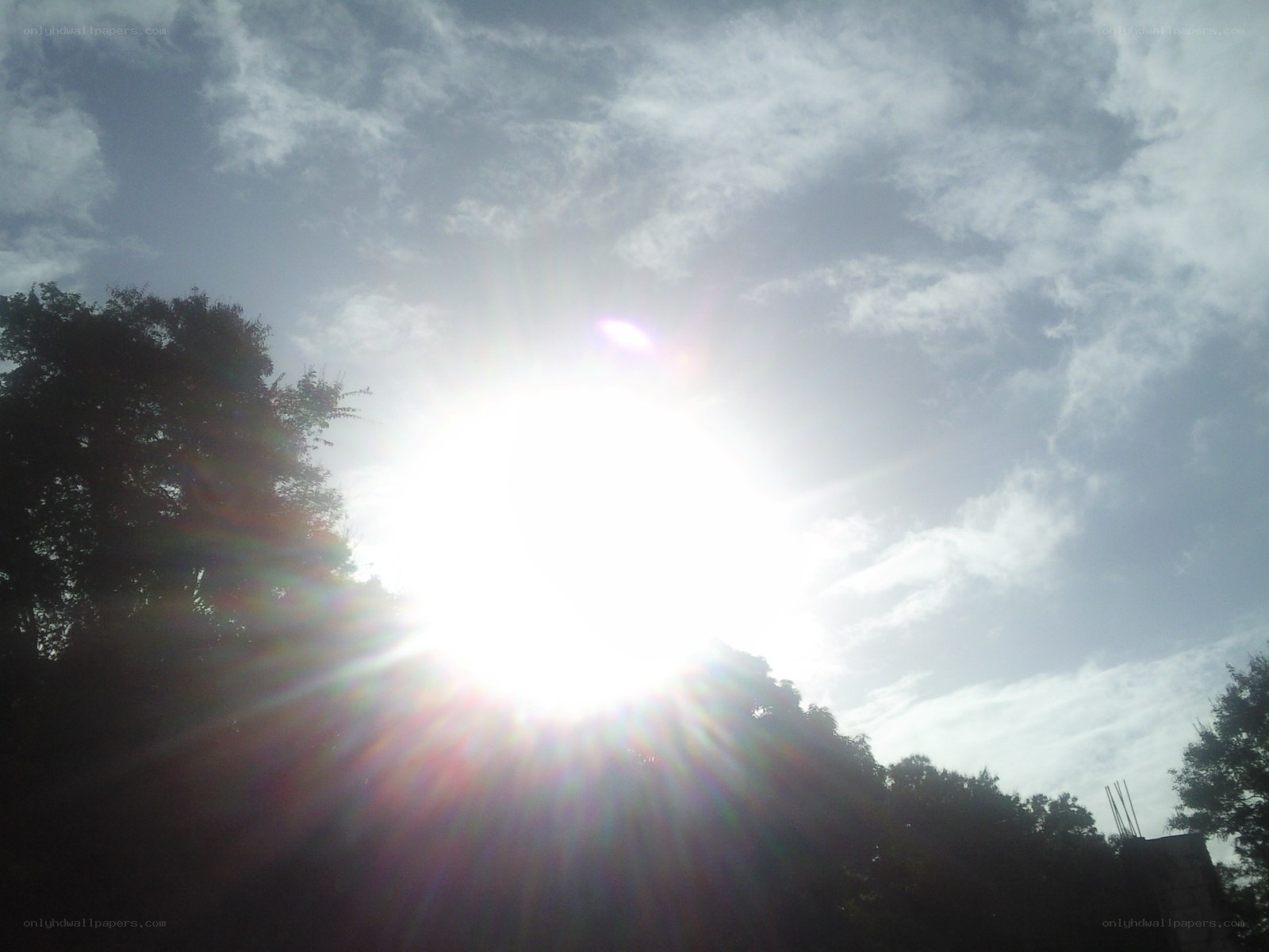 Sun shining through clouds