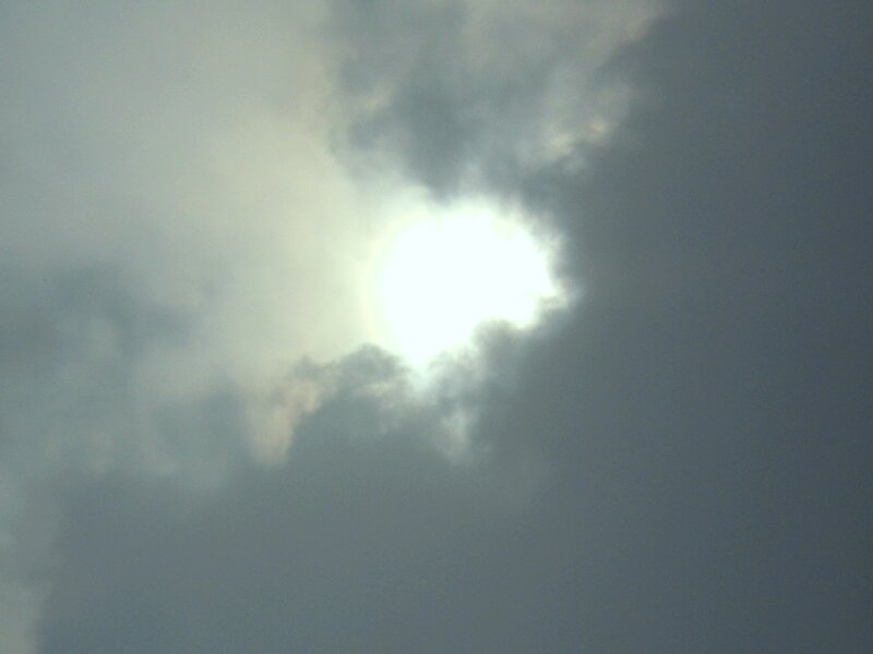 Sun shining through clouds