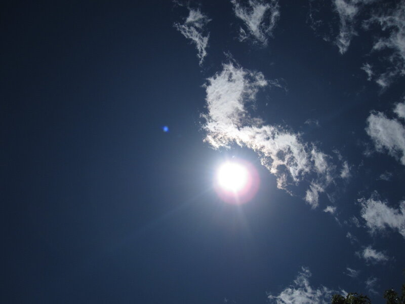 Sun shining through clouds