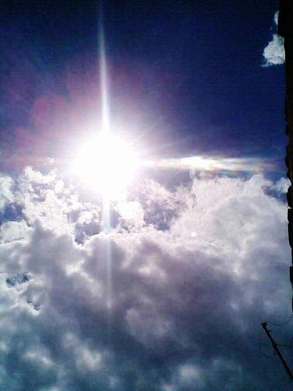 Sun shining through clouds