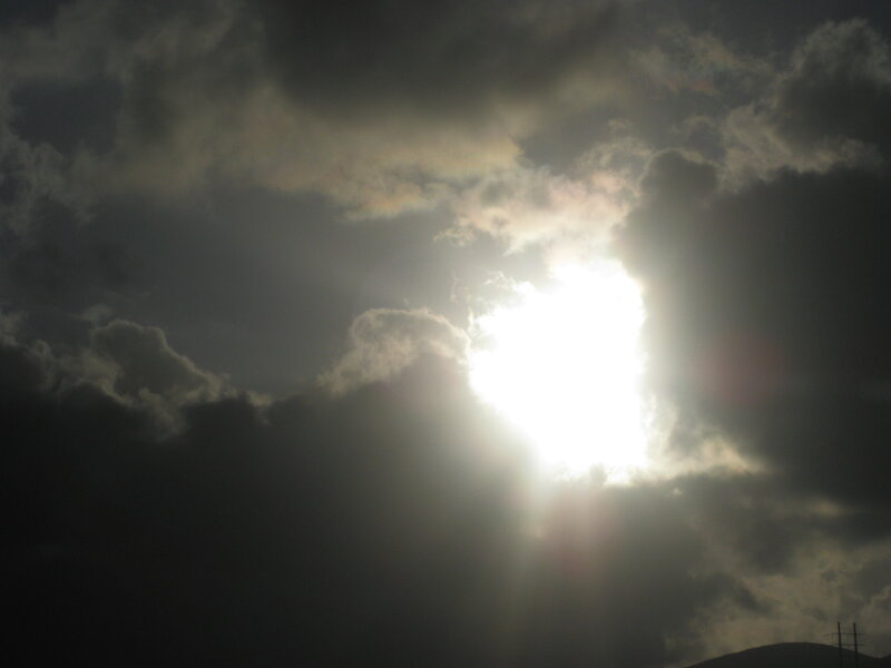 Sun Shining Through Clouds — Gray