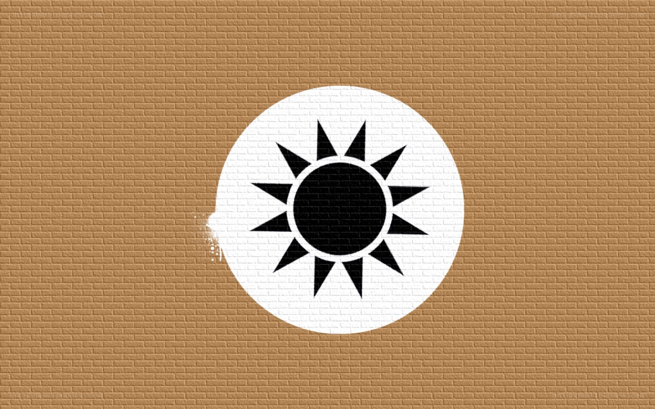Sun symbol on brick wall