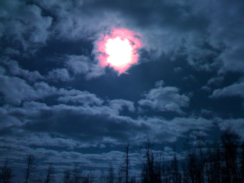 Sun through clouds at dusk