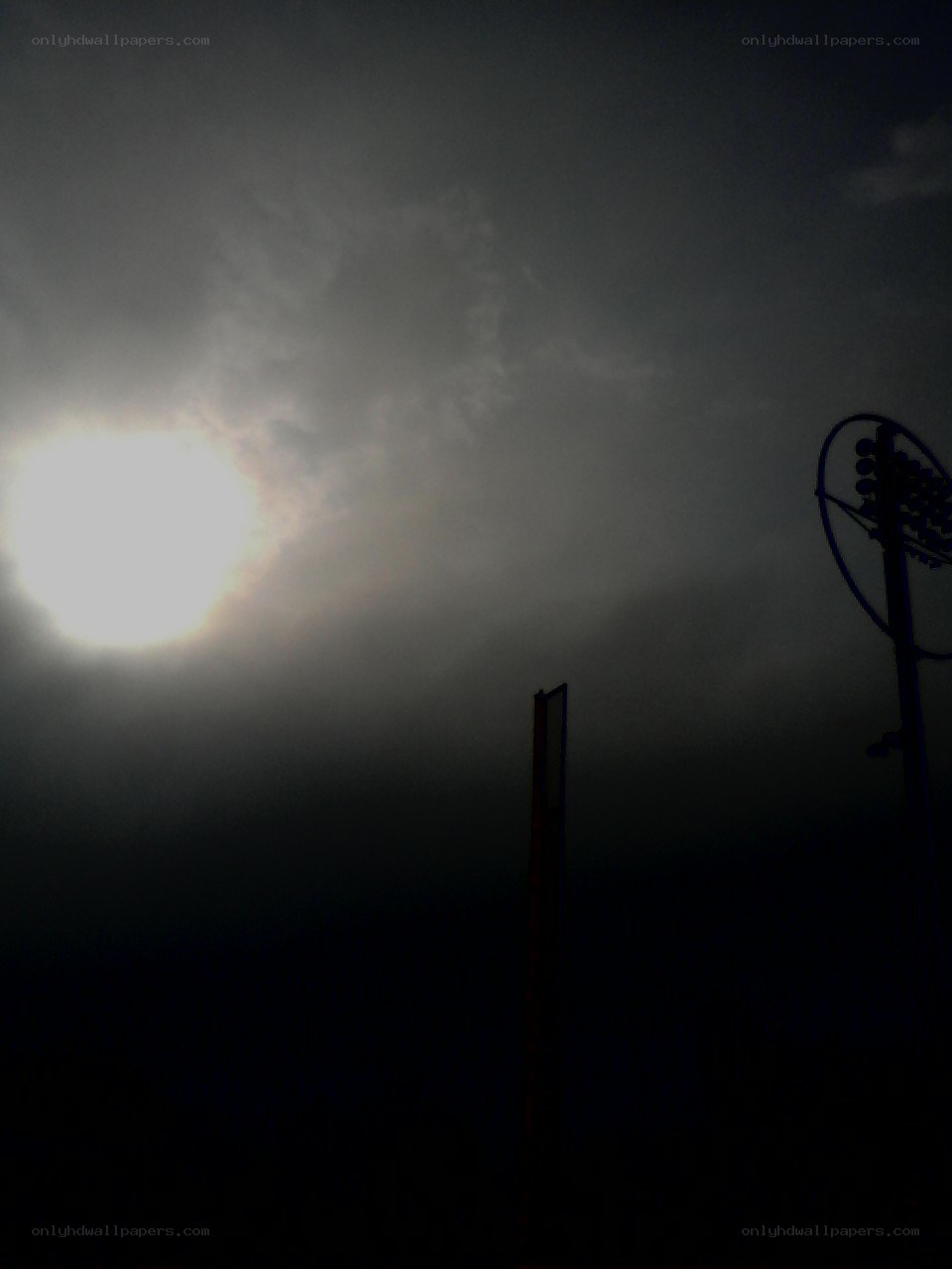 Sun through clouds at night