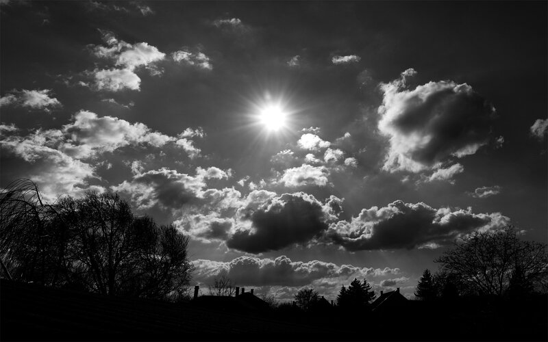 Sun Through Clouds — Black, Dramatic