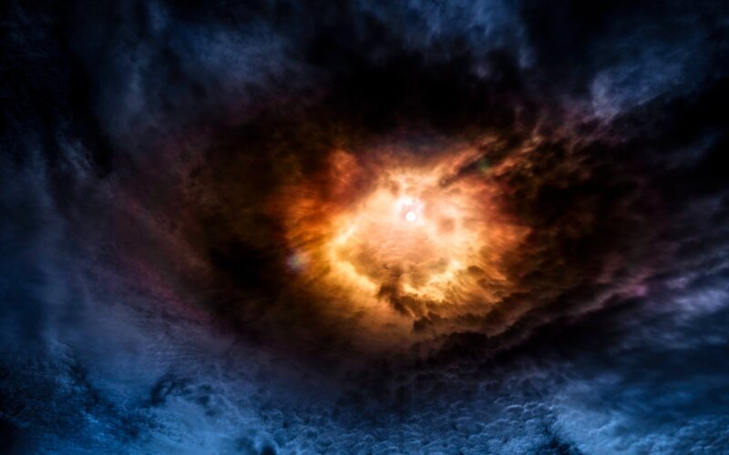 Sun Through Storm Clouds — Blue