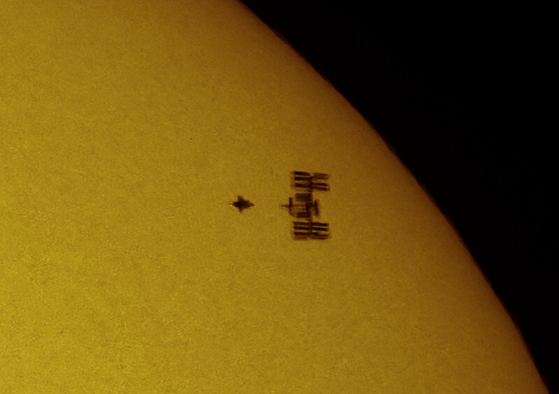 Sun with sunspot and spacecraft