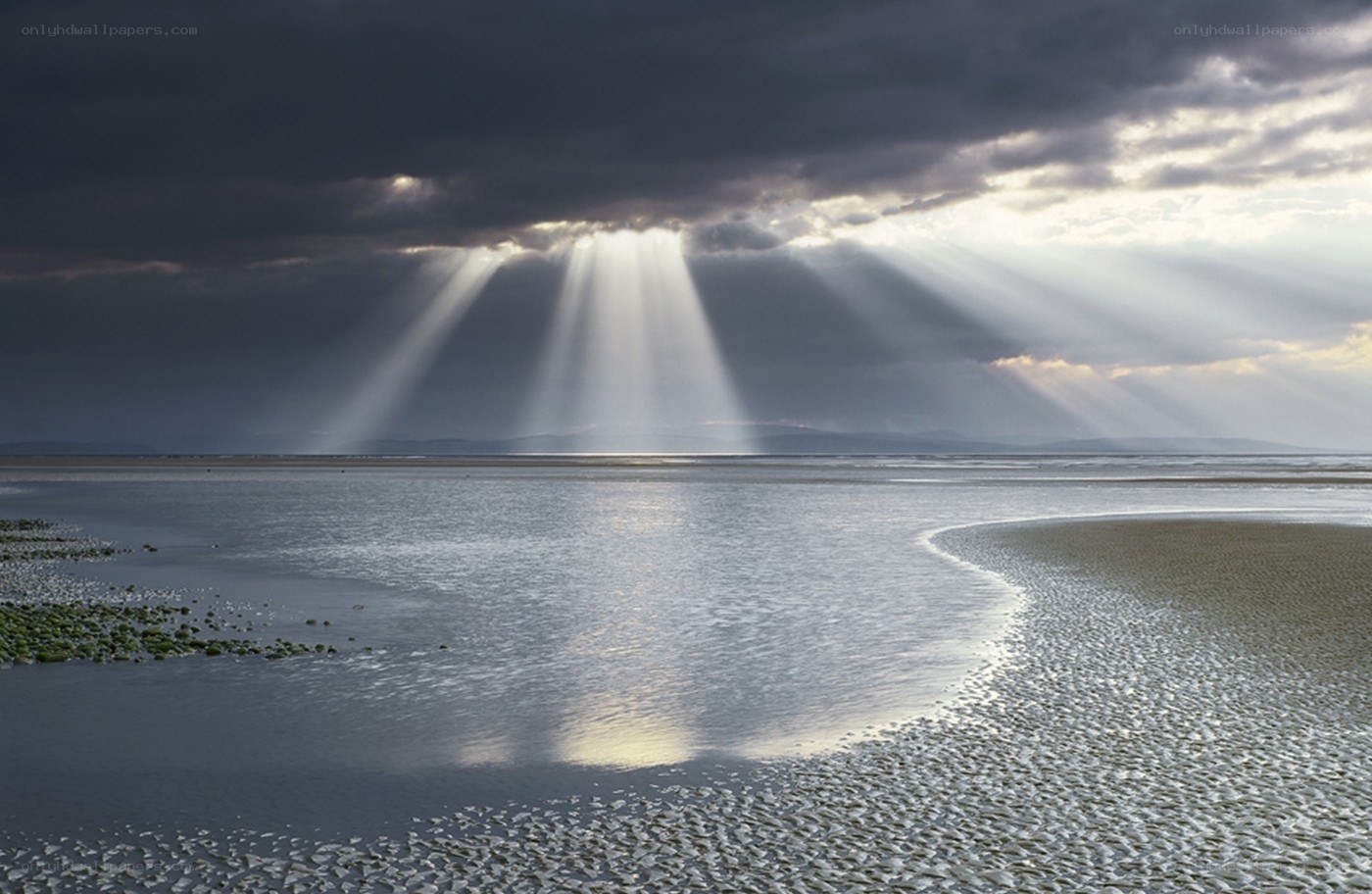 Sunbeams over a tidal flat