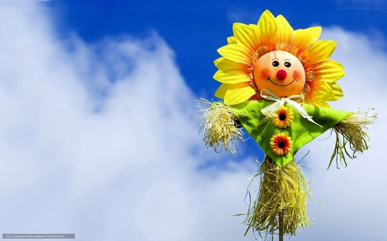 Sunflower scarecrow in blue sky