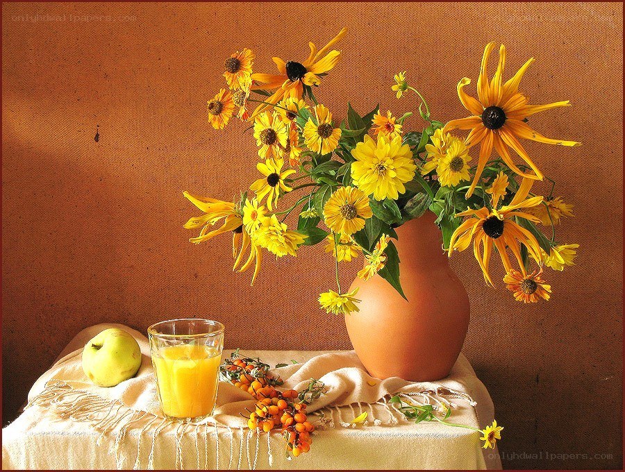 Sunflowers and fruit on a table
