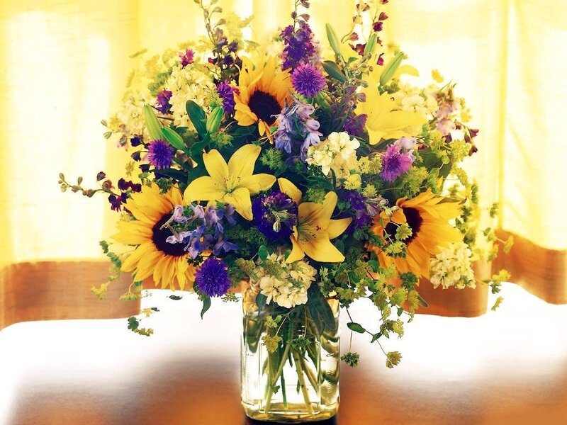 Sunflowers and lilies in a vase