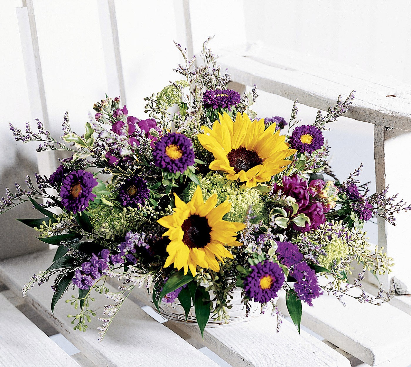 Sunflowers and purple flowers